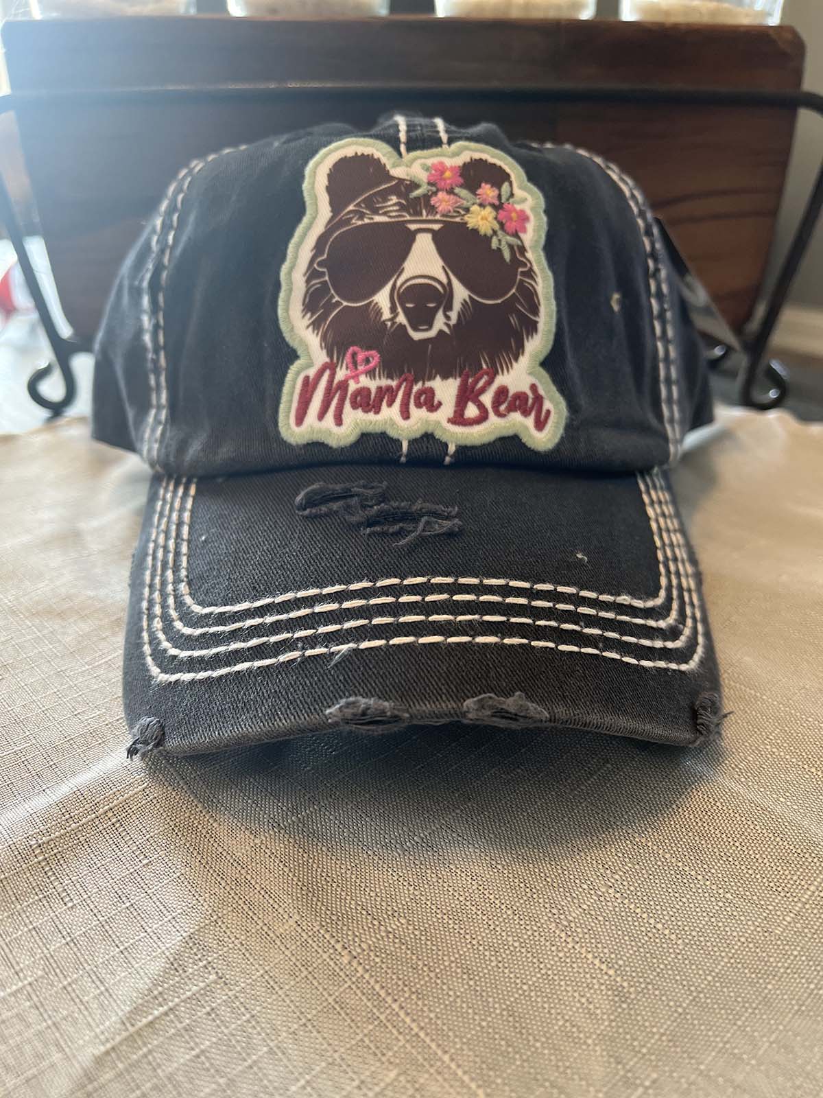 front of black distressed hats