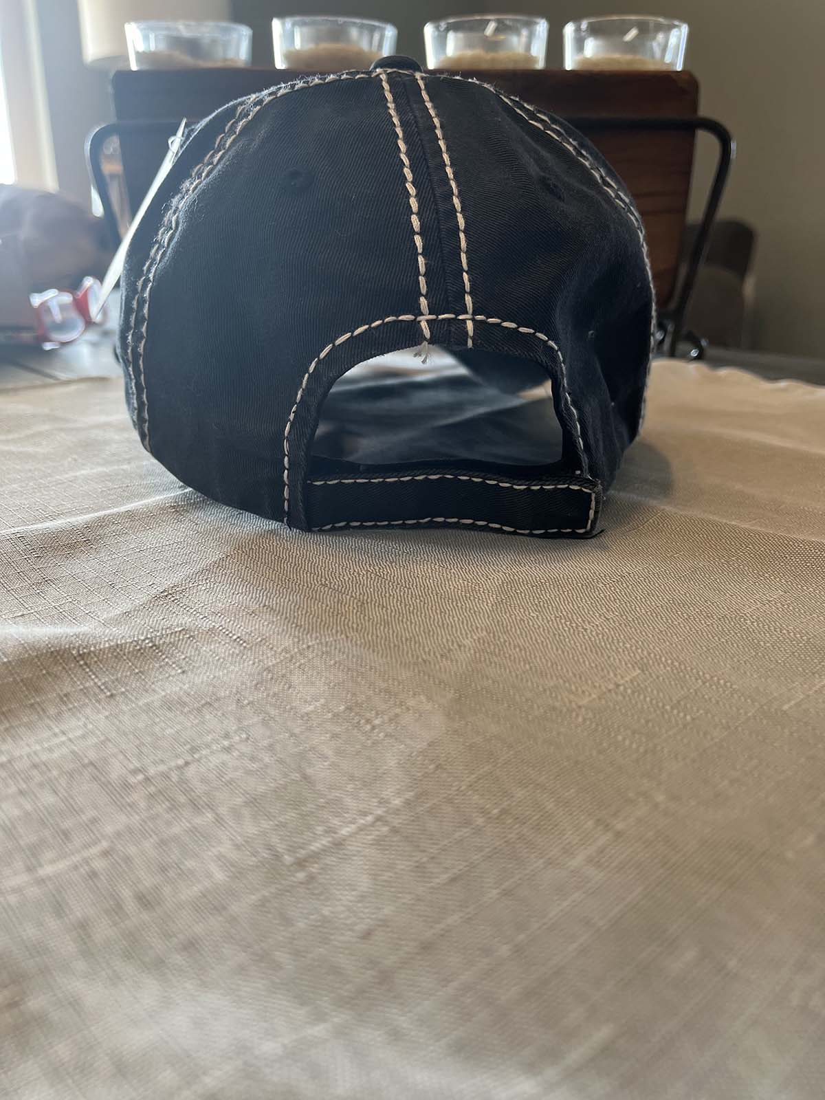 back of black distressed hats
