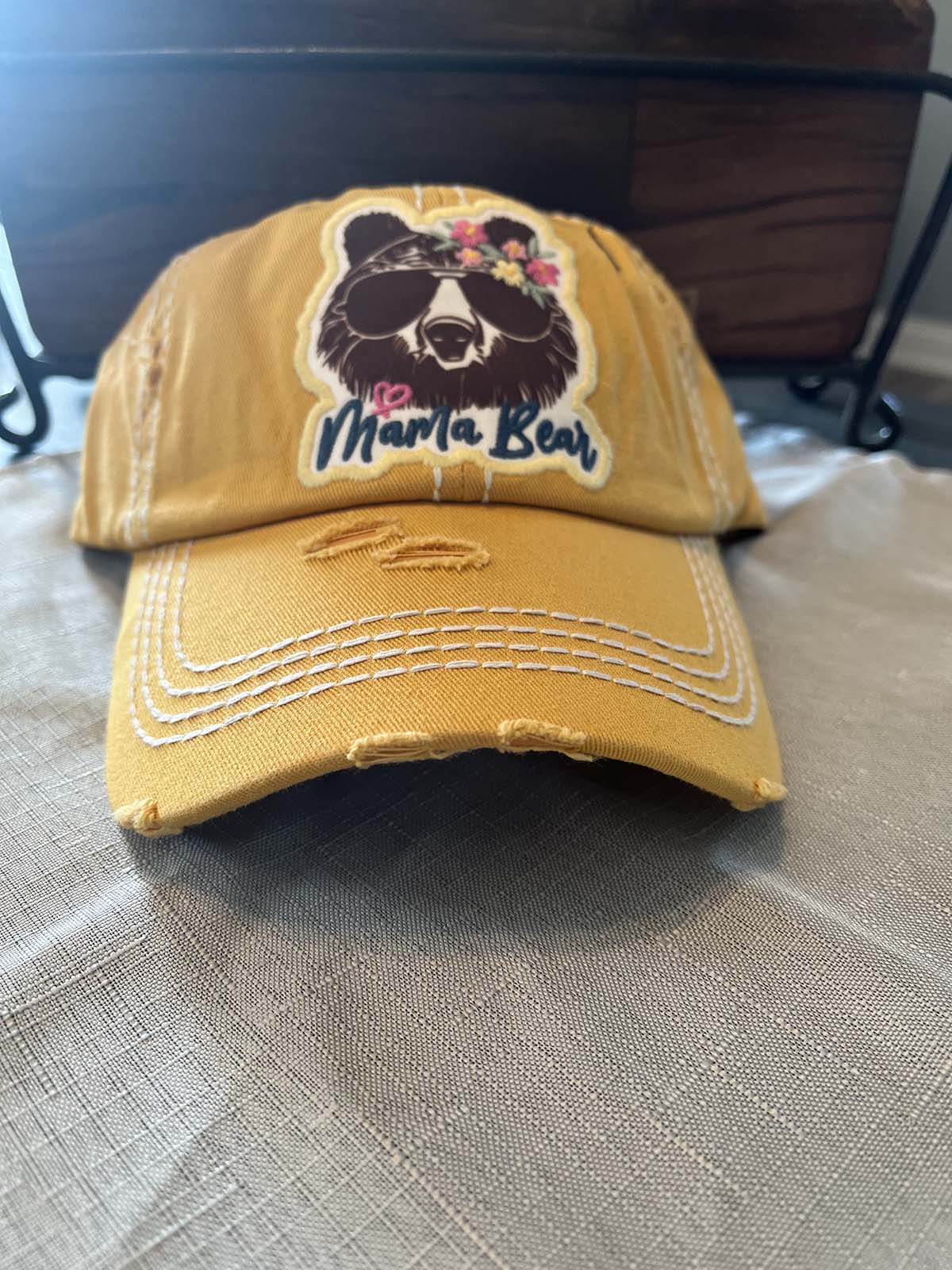 front of yellow distressed hats